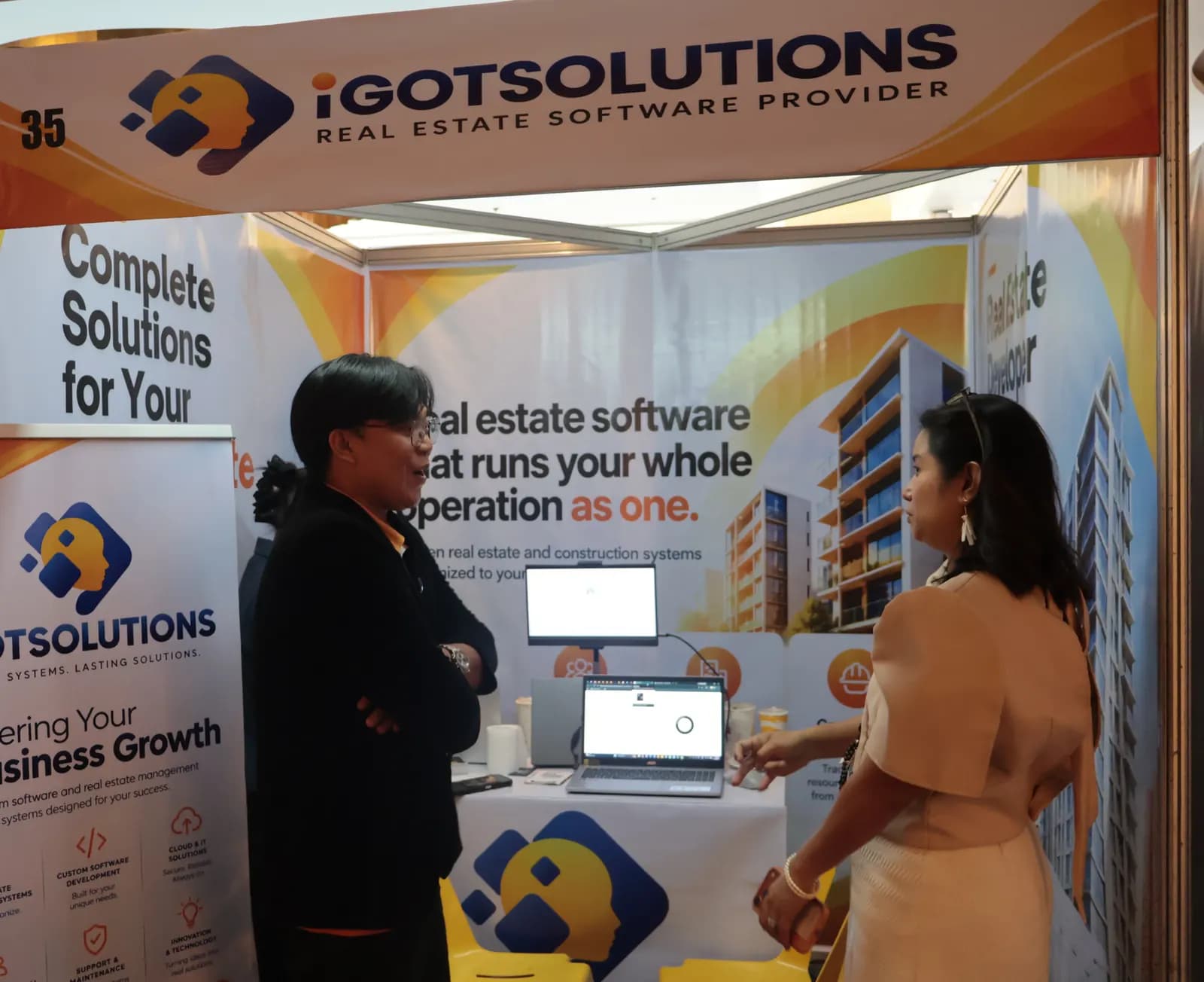 Consultation with a visitor at the iGotSolutions booth, CREBA National Convention 2026, Cebu