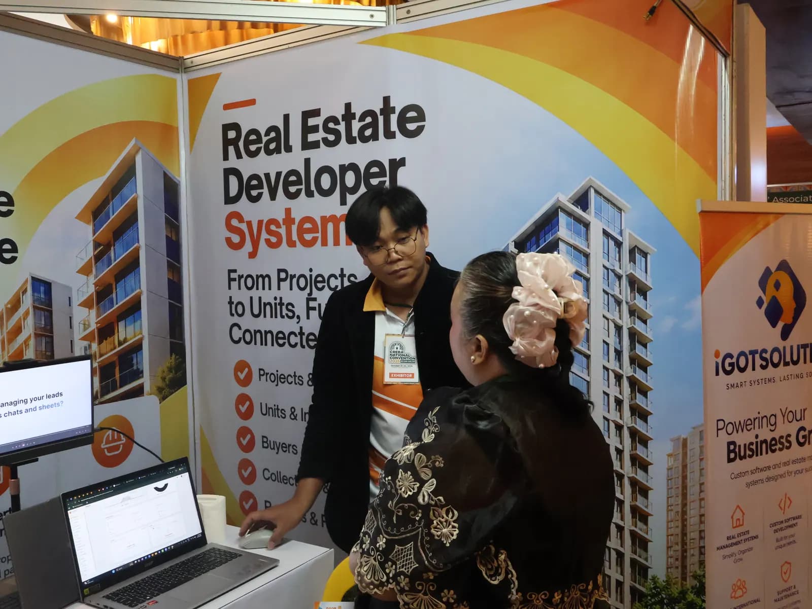 Software walkthrough for a visitor at the iGotSolutions booth, CREBA National Convention 2026, Cebu