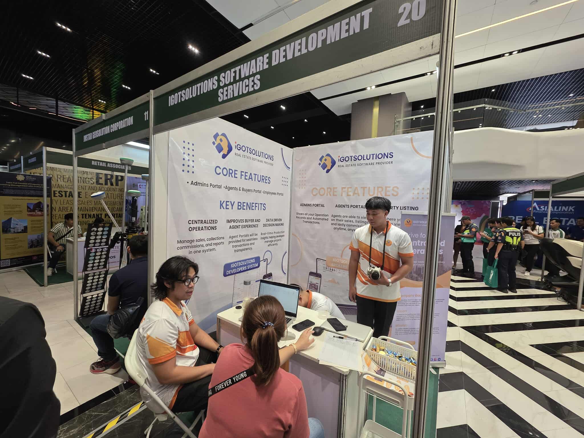 iGotSolutions convention booth showcasing real estate software features